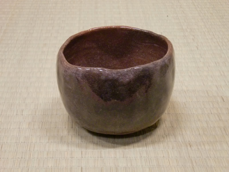 The fifteenth RAKU Kichizemon AKA CHAWAN(red tea bowl), stamped at the bottom with tomobako signed by the artist
